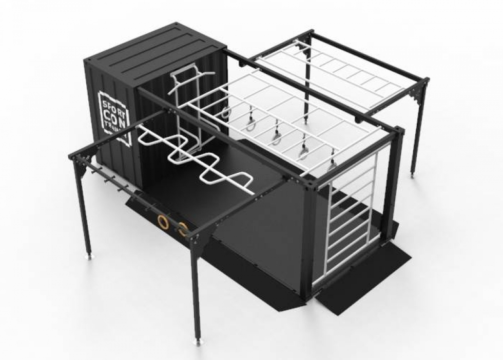 De sportcontrainer. De sportcontrainer is zwart van kleur en heeft verschillende apparaten/rekken waar men sportoefeningen op kan doen. Op de container zelf staat ook het woord 'sportcontrainer'.